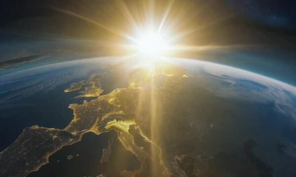 Earth from space with sun rising over Europe