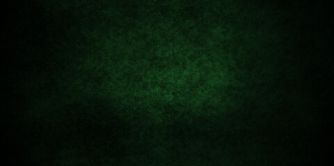Dark green background with grunge backdrop texture, watercolor painted mottled green background, colorful bright ink and watercolor textures on black paper background.