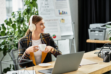 In a modern office, a young woman sips coffee, wearing a trendy checkered blazer and headphones.