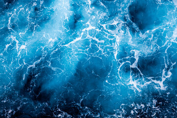 Sea water background. Top view of elegant foamy water. Can be used in covers, packaging, posters, textures, wallpapers, art and design projects. Stunning nature background image.