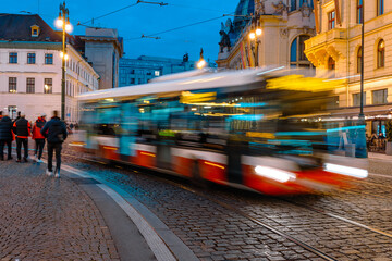 Night Trails Of A Bus Weaving Through Prague Streets, Fast-Moving Public Transport