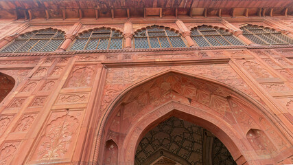 Obraz premium The historic Mughal fort - Lal Qila or the Red Fort at Delhi was commissioned in 1639, was the pinnacle of Mughal architecture during Shah Jahan's reign, blending Persian palace influences.