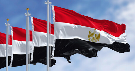 National flags of Egypt waving in the wind on a clear day