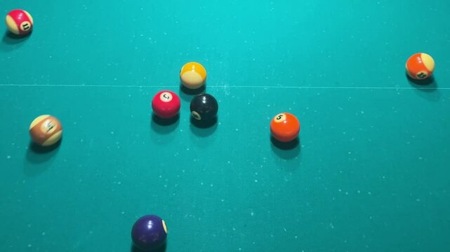 billiard balls on a green table