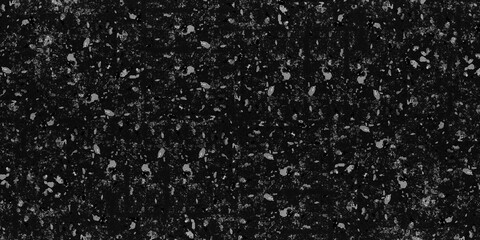 Close up of a dark, speckled stone texture with various shades of gray and black. Graphic design, architecture, interior design projects