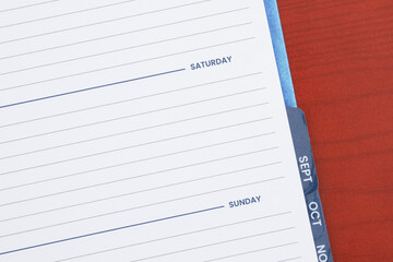 Empty day planner with Saturday on desk