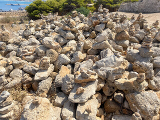Stones on a hillock. Pyramid of stones