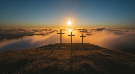 Obraz premium Three Crosses on a Hilltop Against a Stunning Sunset with Sun Rays Illuminating the Landscape and Clouds, Symbolizing Peace, Faith, and Solitude in Nature