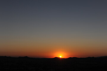Sunset in the desert with clear sky in summer