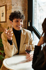 A joyous couple shares moments filled with laughter while enjoying a romantic dinner.