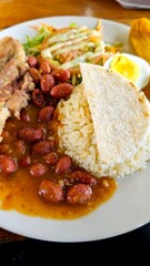 Hearty plate of rice, beans, and meat. A delicious and satisfying meal.