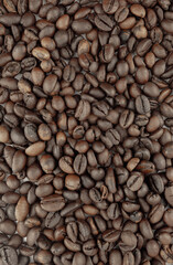 Roasted coffee beans, rich brown color, close-up view. Perfect for coffee shop menus, packaging, or websites.