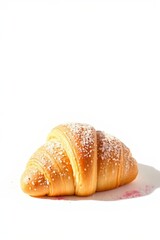 there is a croissant on a white surface with a pink spot