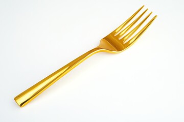 shiny gold fork with polished finish lying diagonally on clean white background