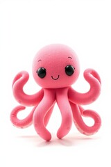 there is a pink octopus toy with a black eyes and a smile on its face