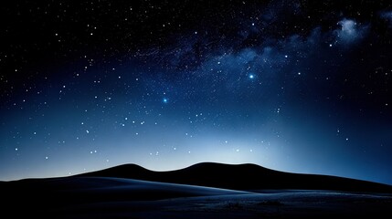 Fototapeta premium The sky is starry; the moon shines from afar, casting light on the rolling hills and sandy dunes