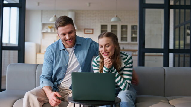 Soulmates talking virtual meeting laptop relaxing apartment living room closeup