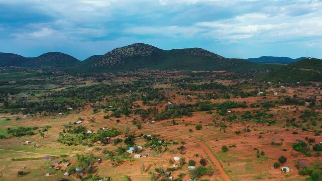 An aerial view of a village with traditional huts nestled among dense forests along the shores of Lake Victoria, Africa's largest freshwater lake. The lake's vast waters are vital to the region.
