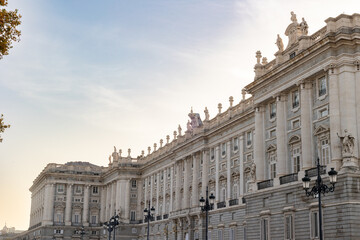 Fototapeta premium Views of the Royal Palace in Madrid, Spain at sunset. The Royal Palace of Madrid is the official residence of the King of Spain; however, the royal family does not live there, but in the Zarzuela Pal