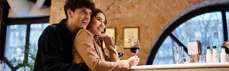 A young couple shares laughter and moments of joy while enjoying their Valentines dinner, banner
