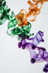 Close-up view of colorful ink drops dispersing in water, creating mesmerizing fractal-like shapes