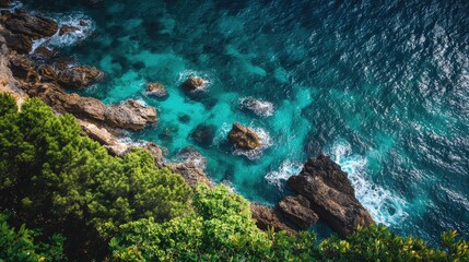 Obraz premium Coastal cliffs and clear turquoise waters showcasing the natural beauty of an island shoreline from an elevated perspective