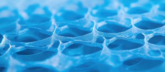 Close up view of textured vibrant blue plastic netting ideal for design and crafting projects showcasing unique patterns and details