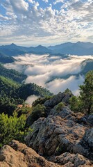 Majestic mountain landscape with lush greenery and misty clouds at dawn