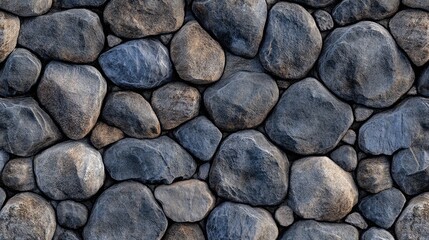 Fototapeta premium Textured cobblestone background featuring varying grey stones in an artistic arrangement suitable for design and architectural projects