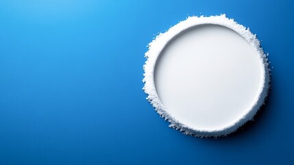 A white plate with a coarse salt rim sits on a vibrant blue background, ideal for food and beverage photography, menus, or marketing materials related to desserts and cocktails,