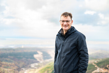 45 yo hiking man posing in the mountains of Kruja, Albania