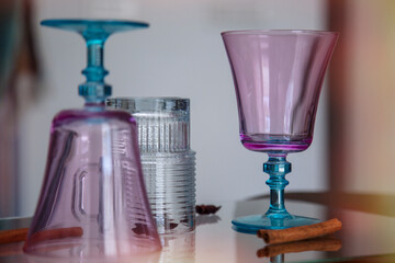 Colorful glass vases on a table in the interior of the room