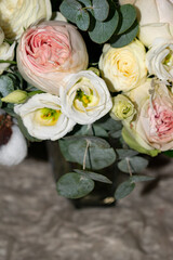 Close-up of blooming roses in a soft pastel bouquet. A beautiful floral arrangement perfect for celebrations or greeting cards.