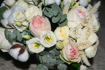 Close-up of a bouquet of peony roses on a dark background. A perfect representation of beauty, romance, and floral elegance.