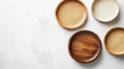 Eco Friendly Kitchen Utensils featuring Bamboo Plates and Recycled Paper Bowls on a White Table Top View for Sustainable Dining Solutions