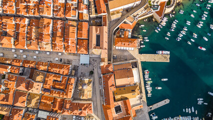 Dubrovnik, the UNESCO World Heritage city on the Adriatic coast of Croatia, captured from a drone, showcases its iconic medieval walls, historic old town, and stunning terracotta rooftops
