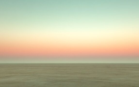 Pastel sunset over a hazy, flat landscape.