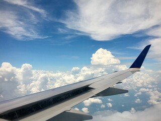 Fototapeta premium Airplane Wing and Clouds 
