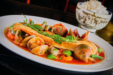 seafood bouillabaisse in a spicy tomato broth