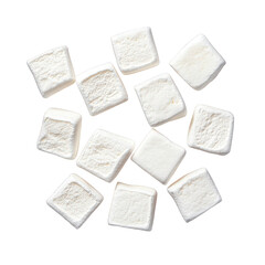 Obraz premium collection of white. fluffy marshmallows arranged in a scattered pattern on a plain background. emphasizing their soft texture and uniform shape. suitable for use in desserts. hot beverages. or as sna