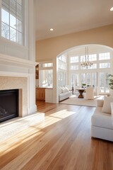 A large open living room with a fireplace and a white couch