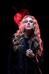 A Striking Portrait of a Woman Surrounded by Smoke in Intense and Dramatic Lighting