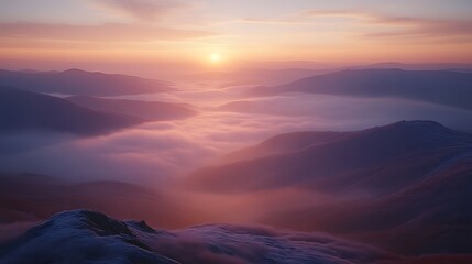 Serene Sunrise Over Misty Mountain Ranges