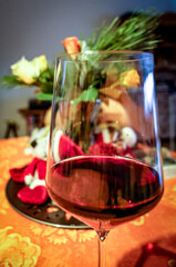 Glas of red wine in festive light ambient