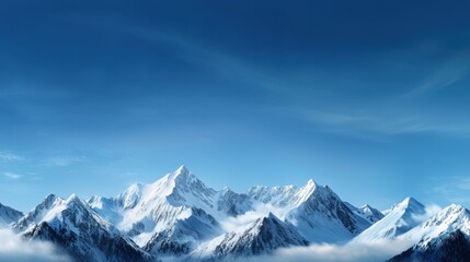 Obraz premium The mountains are covered in snow and the sky is clear and blue