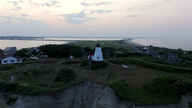 Ascending drone shot of the Plymouth Light (Gurnet Light) at sunset in Plymouth, Massachusetts, USA