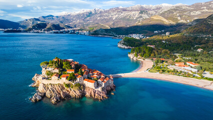 Sveti Stefan, one of Montenegro's most iconic destinations, captured from the drone, showcases its stunning beauty from above. This small islet, connected to the mainland by a narrow causeway