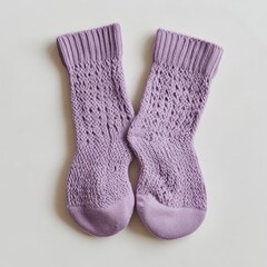 Pair of lavender knitted socks with lacy pattern.