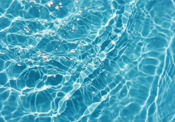 Fototapeta premium Blue clear water surface texture abstract summer banner background with water waves in sunlight