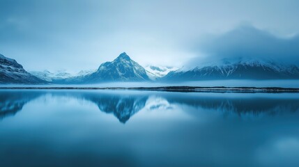 A blue lake with mountains in the background